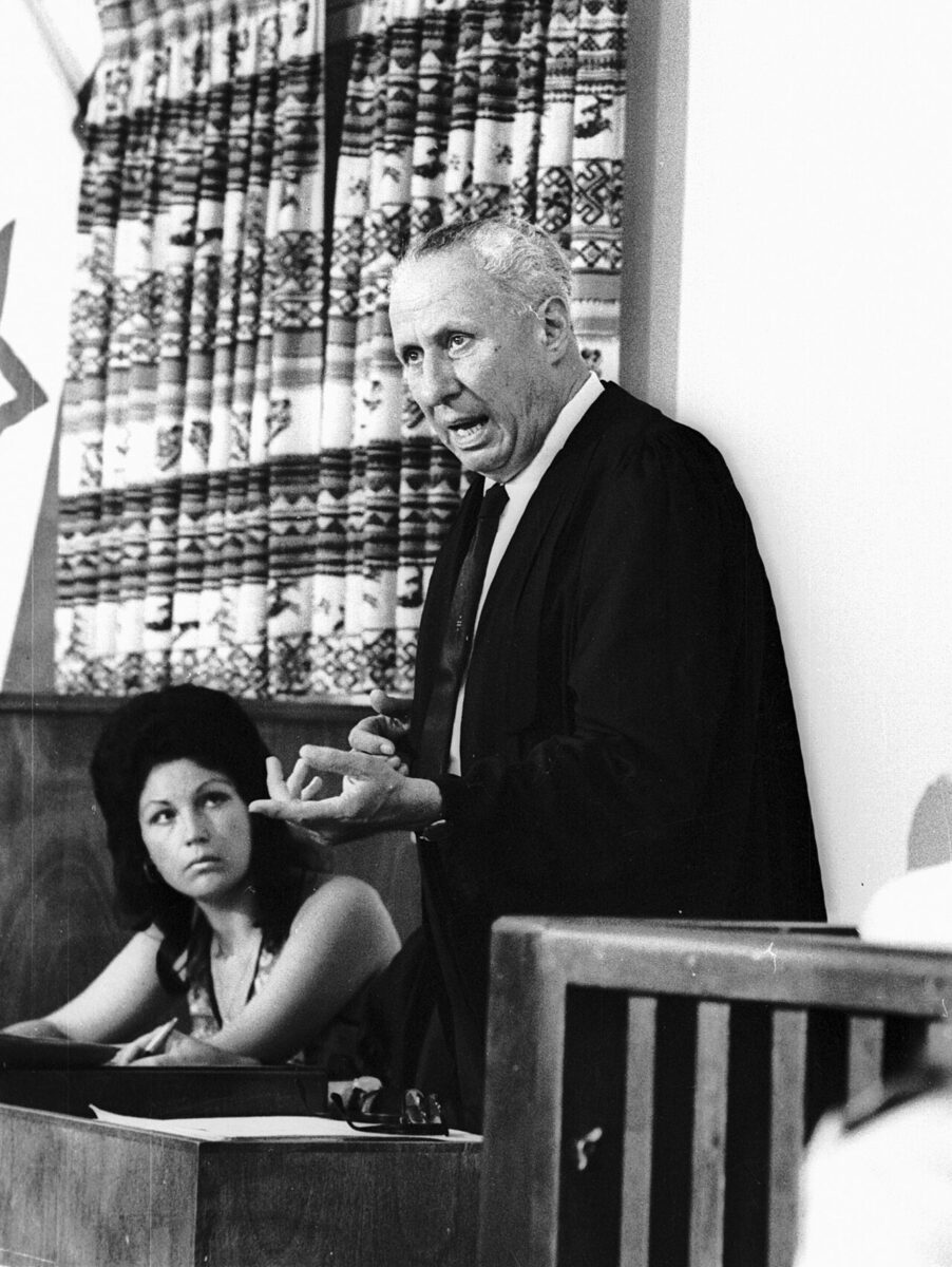 Couple in a courtroom setting facing challenges together