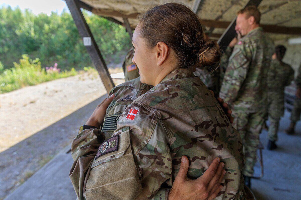 Army Reserve soldiers embracing in a show of support and camaraderie